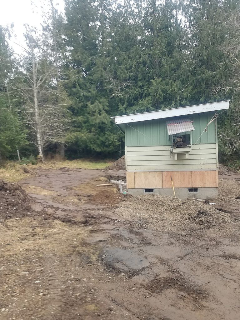 The small building on its finished foundation with skirting installed