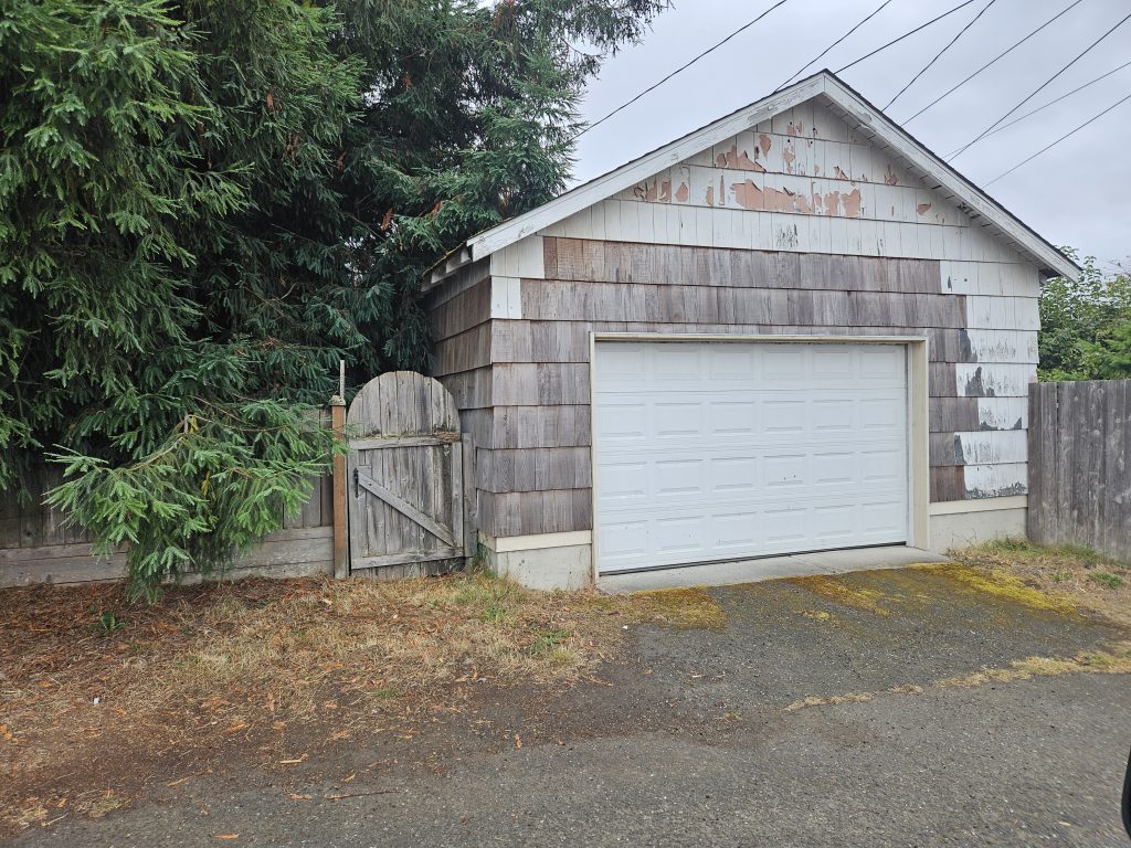 The garage today, seven years after the grandfathered rebuild, still standing