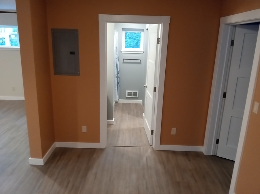 Finished basement apartment hallway and bathroom